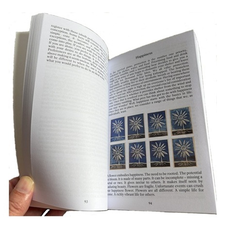 ignorance paradox book opened at happiness page with flowers illustration