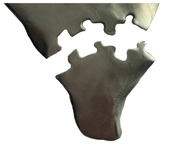 jigsaw cut from a flat piece of silver